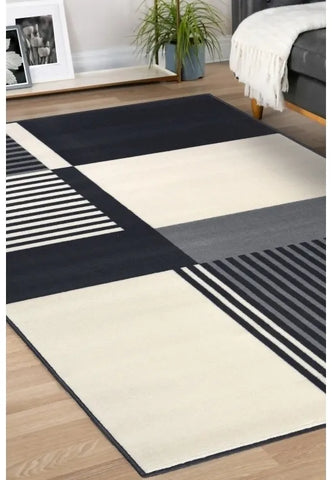 Contemporary rug with soft grey tones and linear pattern.