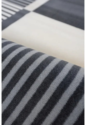 Decorative grey rug with sleek barcode design.