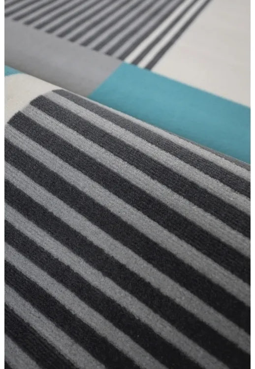 Polypropylene rug with soft pile and durable construction.