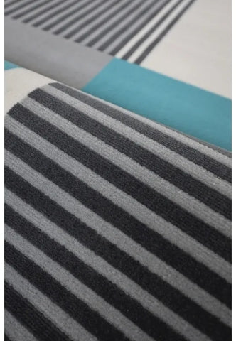 Polypropylene rug with soft pile and durable construction.