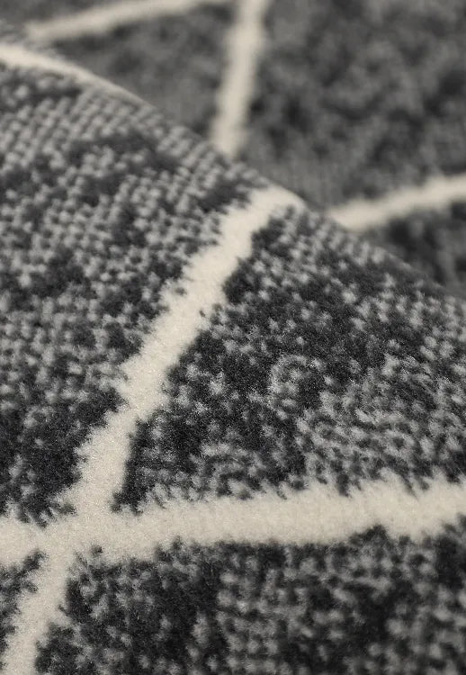 Polypropylene rug with soft pile and durable construction.