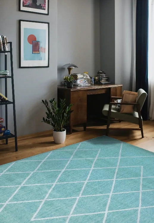 Teal rug with Berber inspired geometric pattern design.