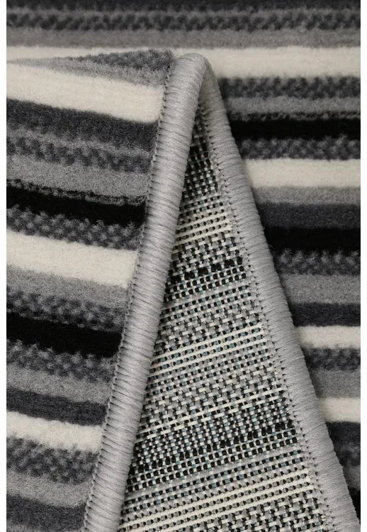 Minimalist rug with refined fine stripe pattern.