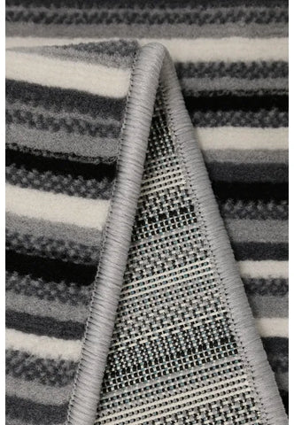 Minimalist rug with refined fine stripe pattern.