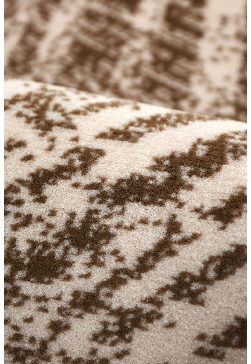 Contemporary rug with abstract swirl detailing.