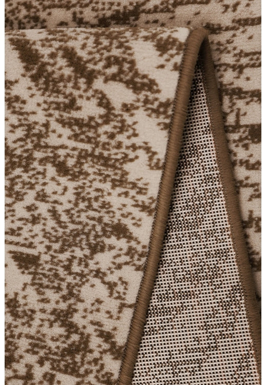 Polypropylene rug with soft pile and durable construction.