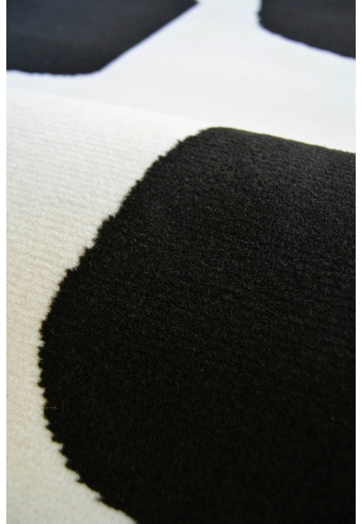 Contemporary rug with modern geo block detailing in black tones.