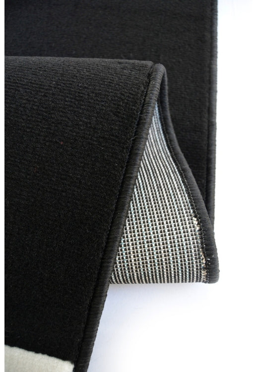 Polypropylene rug with soft pile and durable construction.