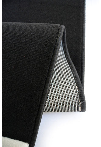 Polypropylene rug with soft pile and durable construction.