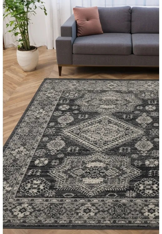 Grey rug with classic medallion pattern and intricate detailing.