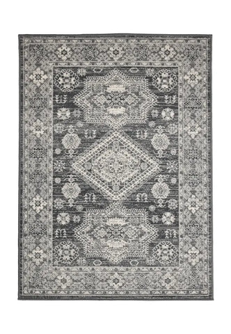 Traditional rug with elegant medallion design in grey tones.