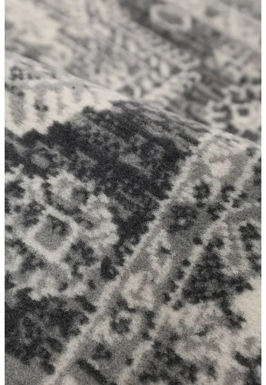 Polypropylene rug with soft pile and durable construction.