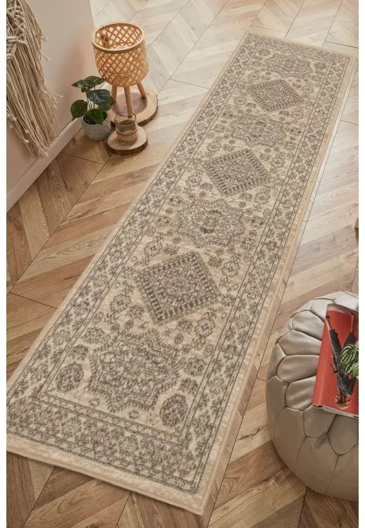 Natural runner rug with classic medallion pattern design.