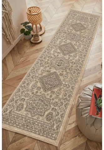 Natural runner rug with classic medallion pattern design.