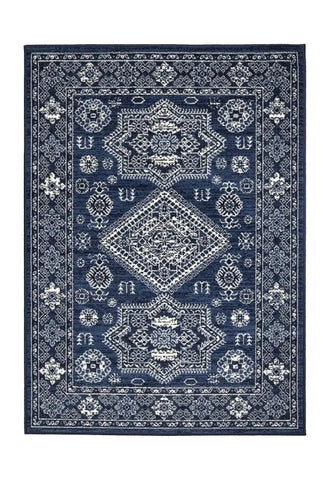 Traditional rug with elegant medallion detailing in deep navy tones.