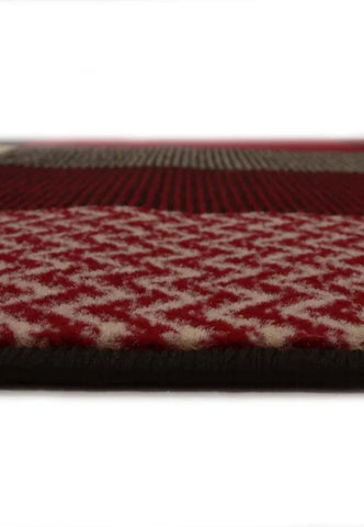 Contemporary red rug adding warmth and character.