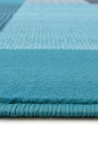 Contemporary teal rug with soft pile texture.
