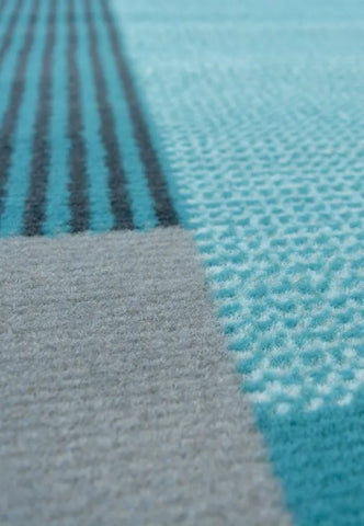 Polypropylene runner rug with soft pile and durable construction.