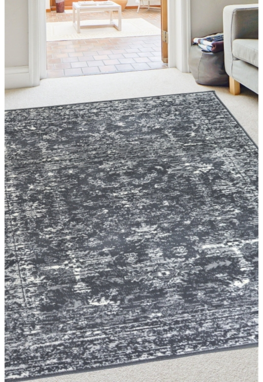 Charcoal rug with traditional inspired pattern.