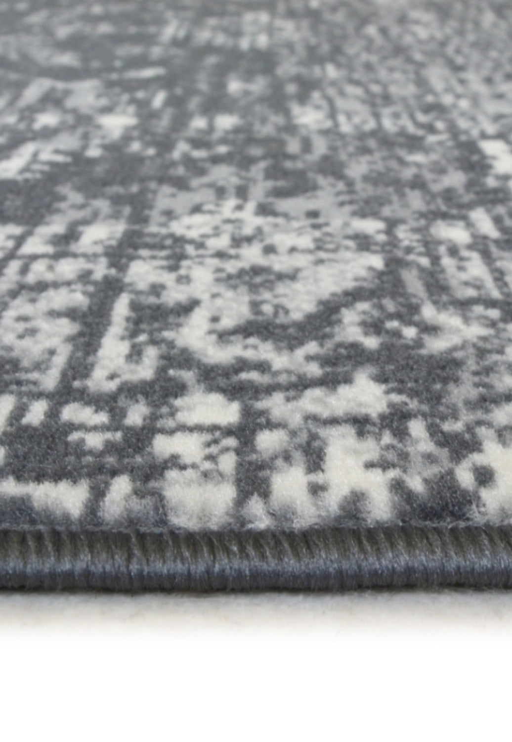Charcoal traditional rug with durable polypropylene fabric.