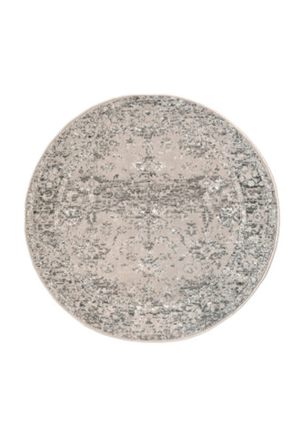 Circular rug with soft pile and classic neutral design.