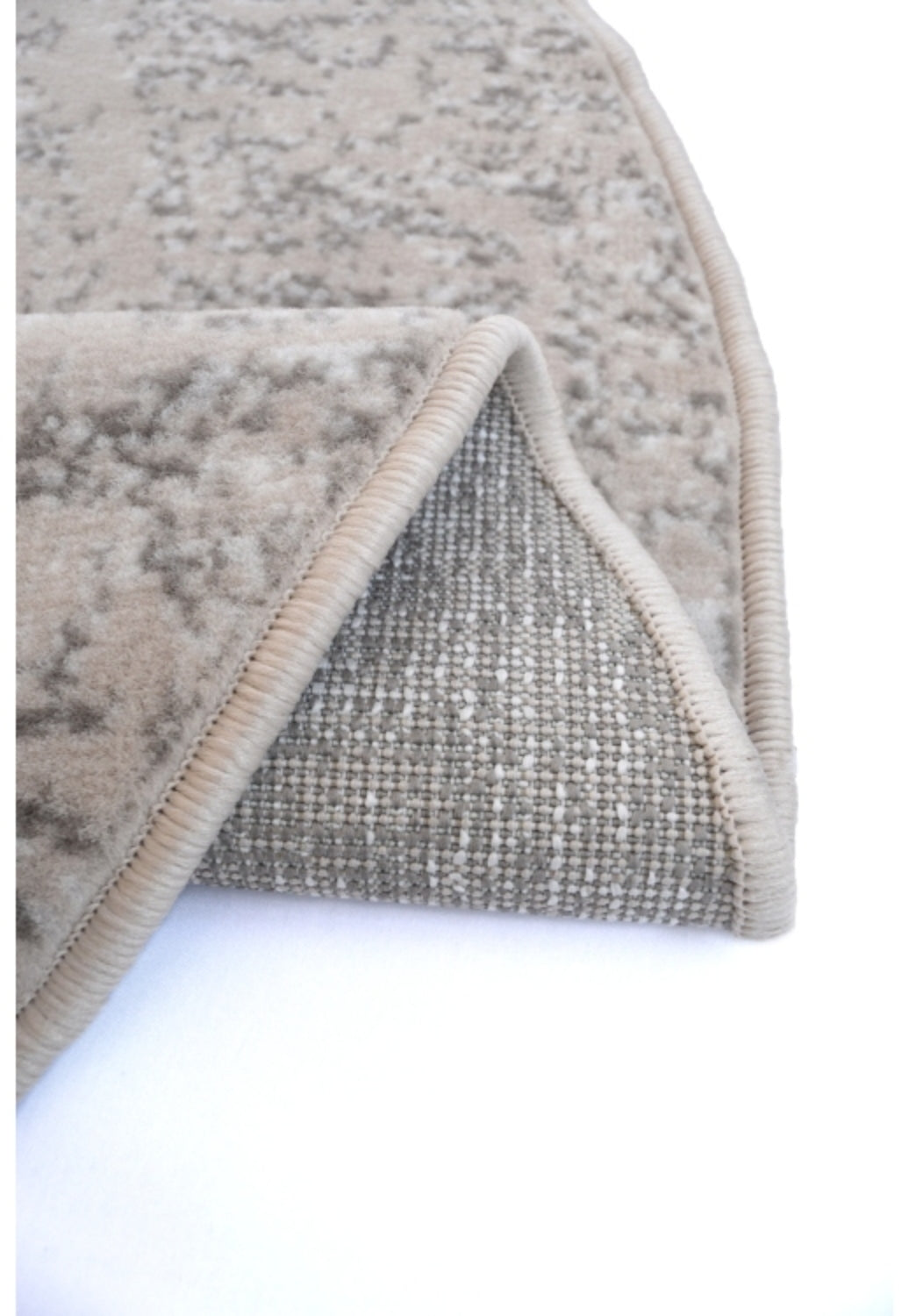 Classic patterned rug with soft pile and neutral cream tones.