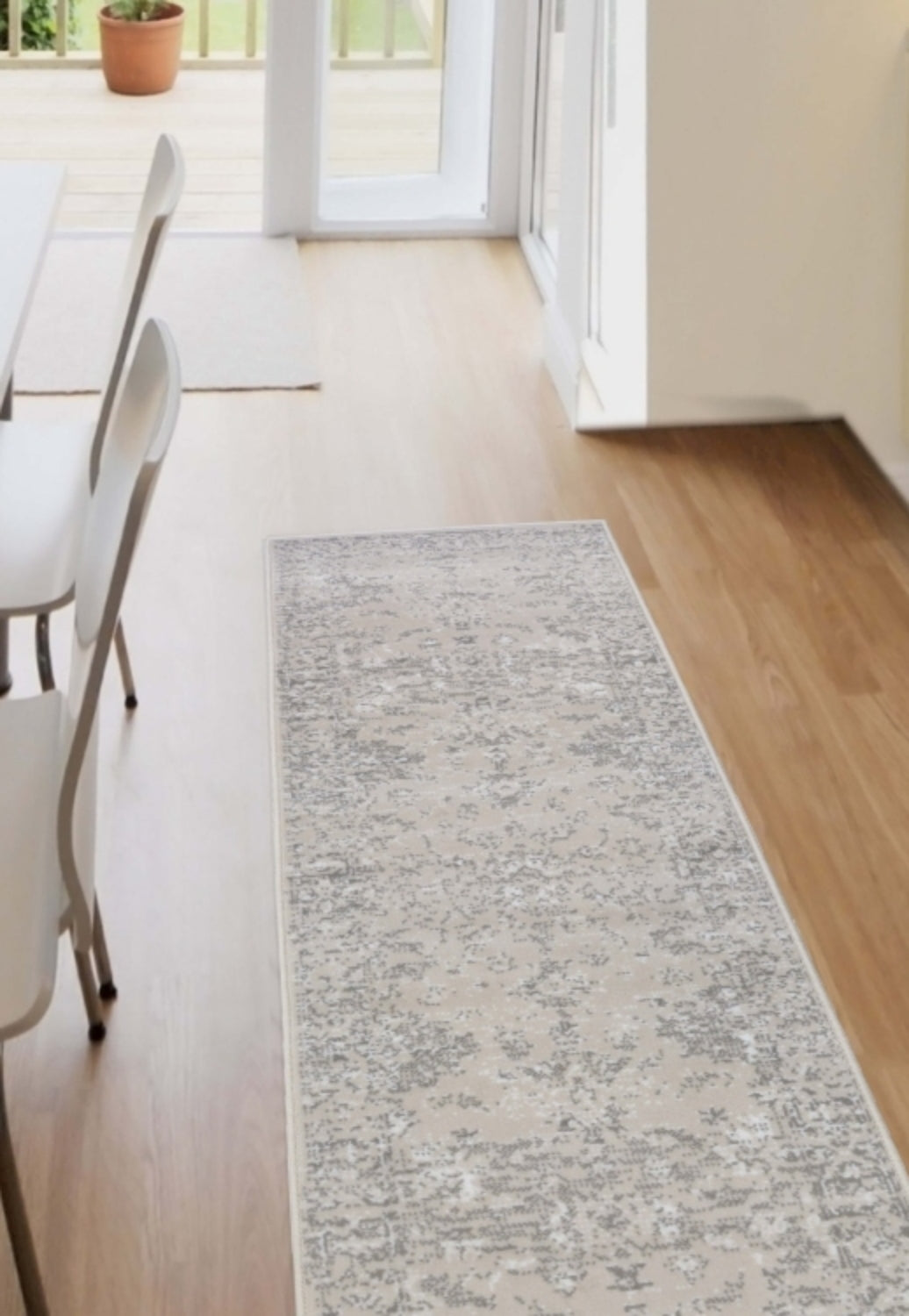 Cream runner rug with traditional inspired pattern.