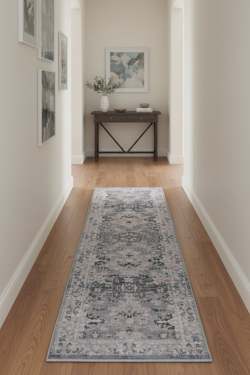 Grey runner rug with traditional inspired pattern.