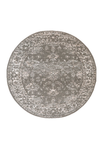 Circular rug with classic design in warm neutral tones.