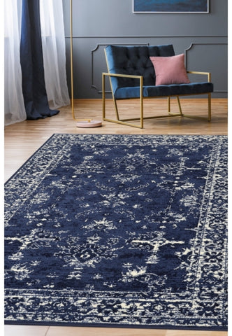 Navy rug with traditional inspired pattern.