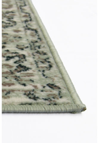 Traditional style rug in soft sage green tones.