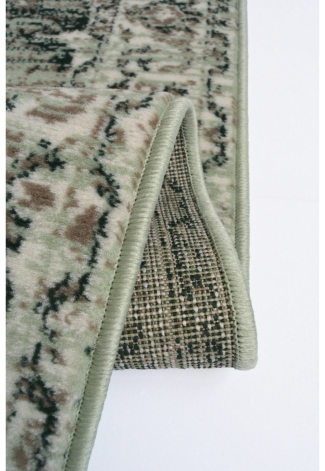 Patterned rug with elegant sage green finish.