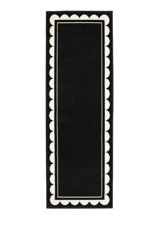 Hallway runner with subtle scallop detailing in black tones.