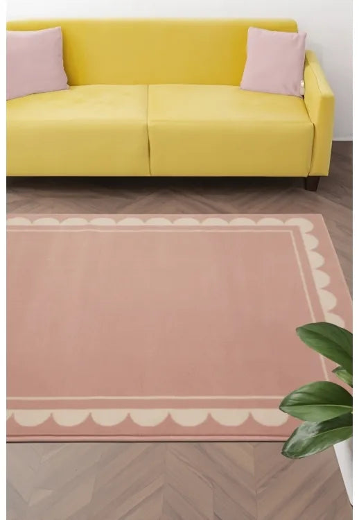 Blush rug with elegant scallop inspired pattern design.