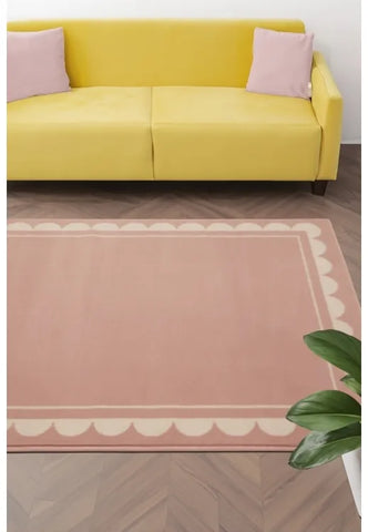 Blush rug with elegant scallop inspired pattern design.