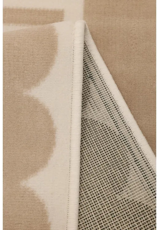Modern rug with refined border pattern in natural tones.