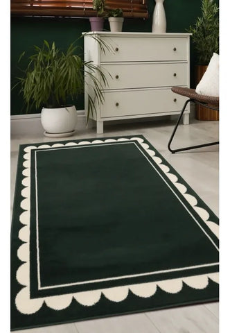 Green rug with stylish scallop inspired pattern design.