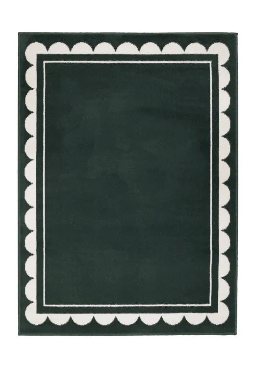 Contemporary rug with subtle scallop detailing in green tones.