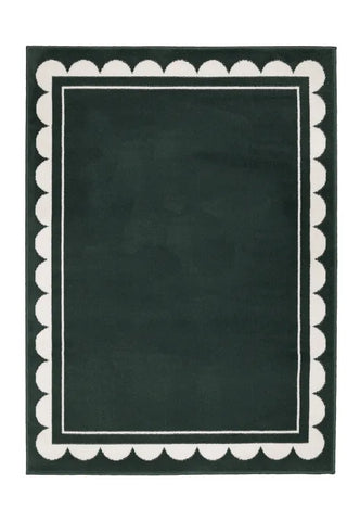 Contemporary rug with subtle scallop detailing in green tones.