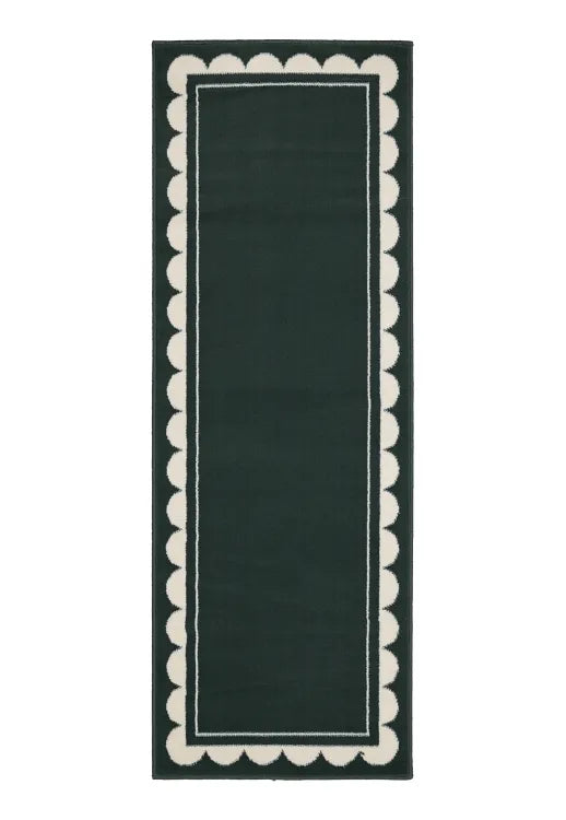 Hallway runner with subtle scallop detailing in green tones.