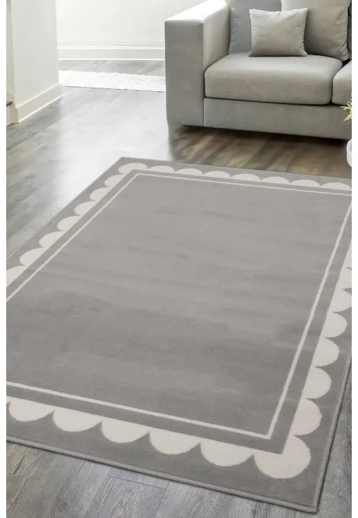 Grey rug with stylish scallop inspired pattern design.