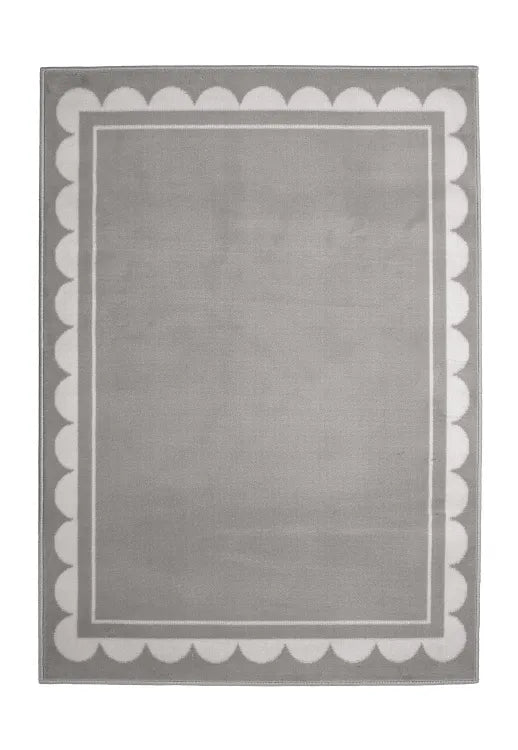Contemporary rug with subtle scallop detailing in grey tones.
