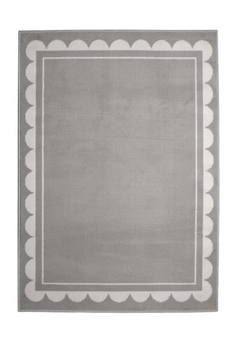Contemporary rug with subtle scallop detailing in grey tones.