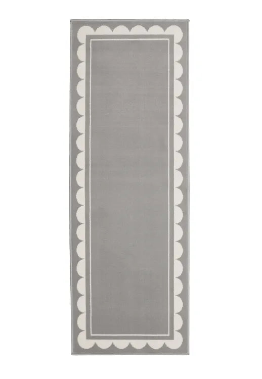 Hallway runner with subtle scallop detailing in grey tones.
