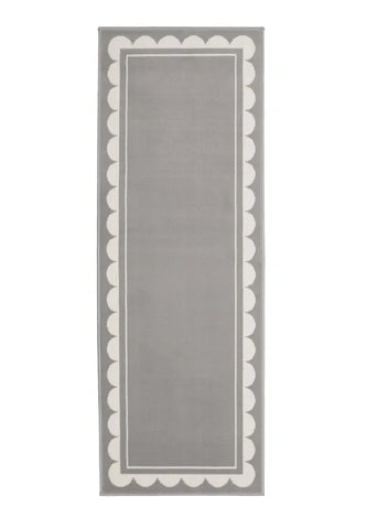Hallway runner with subtle scallop detailing in grey tones.