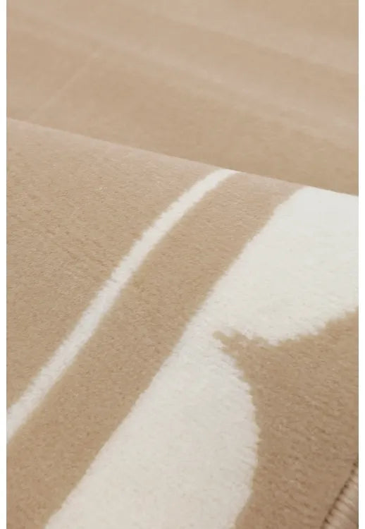 Minimalist rug adding warmth and softness to interiors.