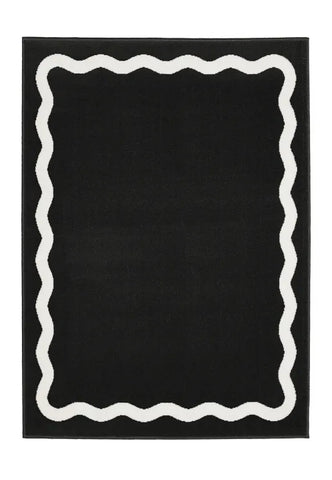 Modern black rug with clean lined scallop pattern.