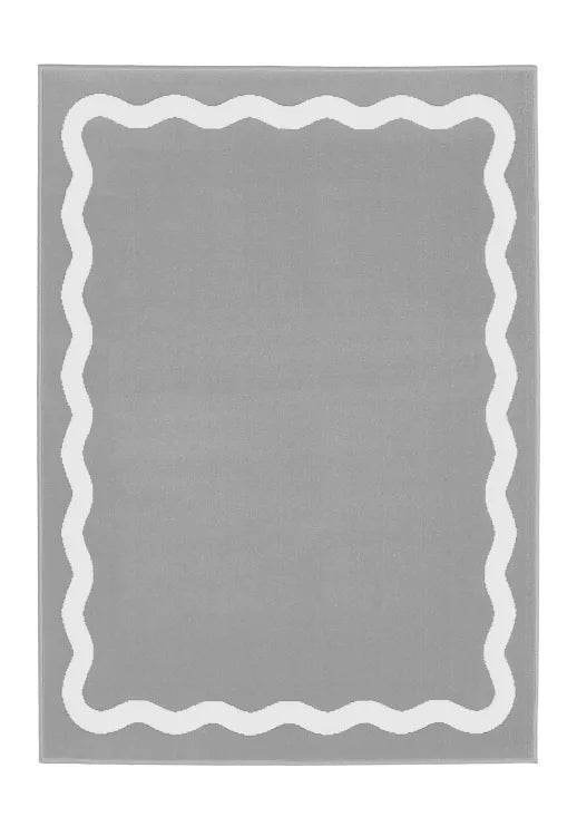 Minimalist grey rug with soft geometric scallop pattern.