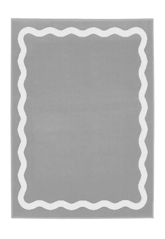 Minimalist grey rug with soft geometric scallop pattern.