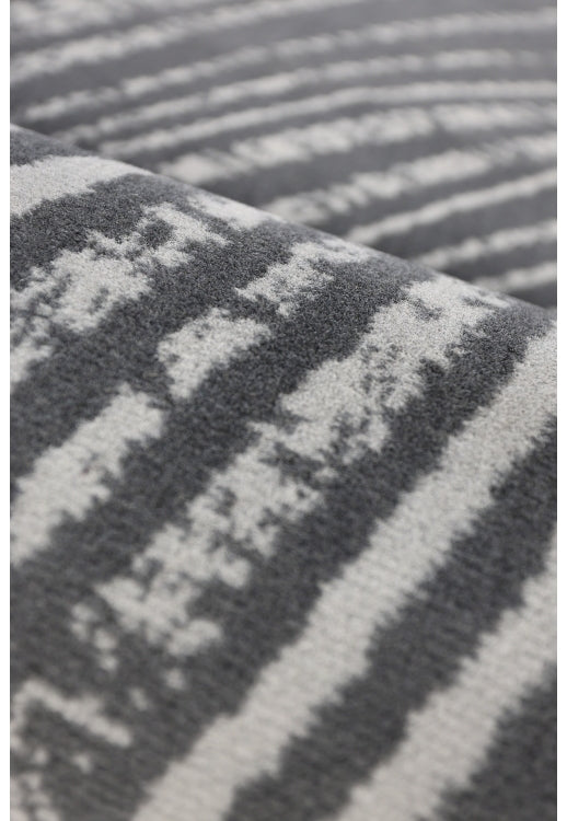 Contemporary rug with textured swirl pattern.
